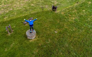 Happy tourist at the highest point of Denmark Møllehøj